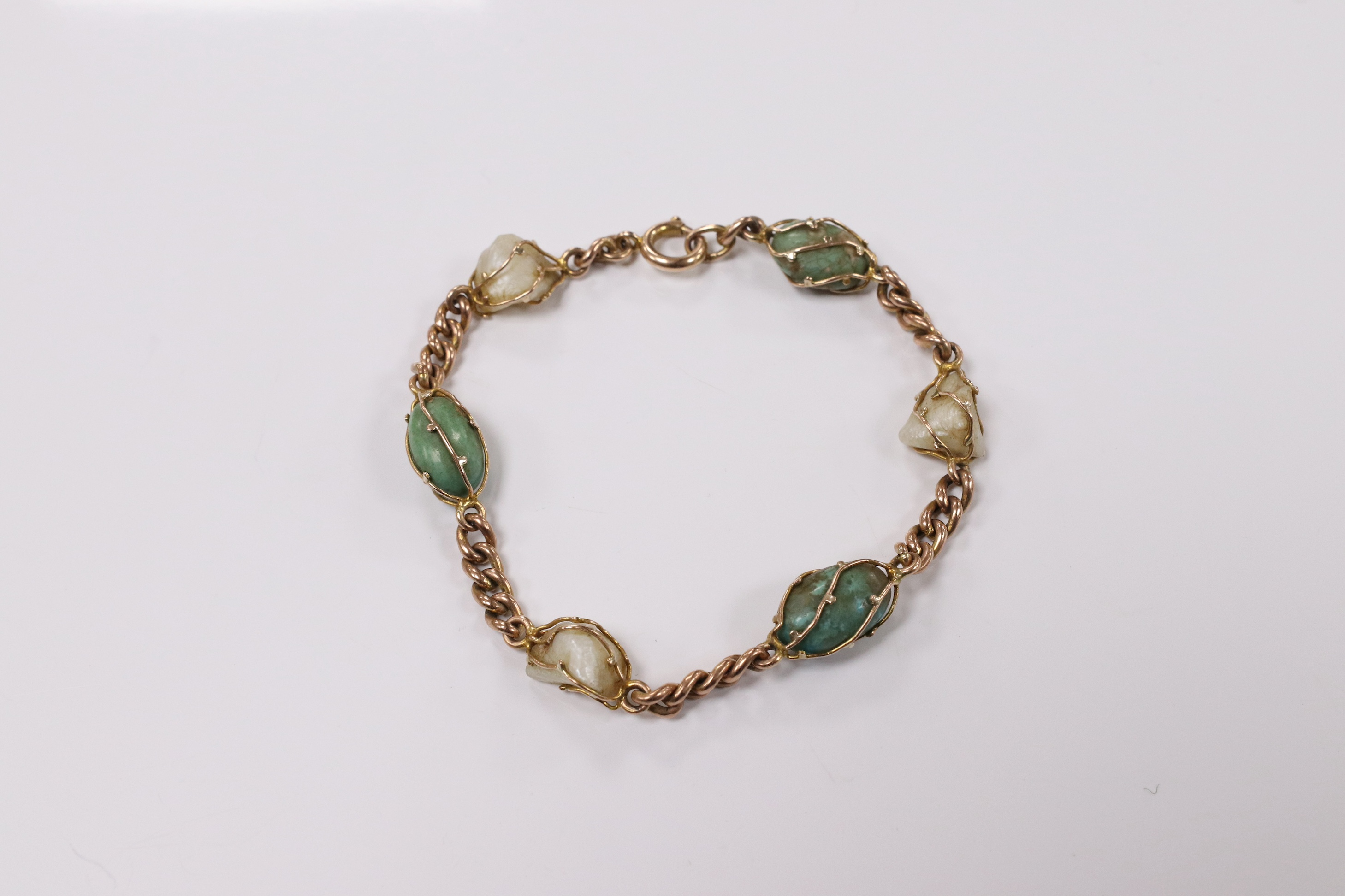 An early 20th century yellow metal, turquoise and baroque pearl set curb link bracelet, 18cm, gross weight 11.1 grams. Condition - fair